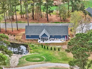 1708 Oakbrook Drive SW, Ocean Isle Beach, NC 28469 – photo 9: Tee-box on 9th Hole in Backyard