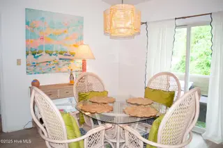 413 Commerce Avenue Unit D, Morehead City, NC 28557 – photo 11: Dining room opens to porch