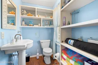 166 NW 7th Street, Oak Island, NC 28465 – photo 20: Guest half bath