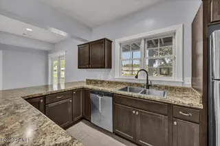 227 Gazebo Court, Wilmington, NC 28409 — 6-bedroom home in Inlet Point Harbor, Wilmington, NC, photo 10 of 67: First-Floor Great Room/In-Law Suite