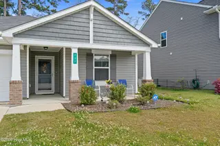 737 Landmark Cove, Carolina Shores, NC 28467 — 4-bedroom home in Landmark at Lighthouse Cove, Carolina Shores, NC, photo 2 of 39: Front Elevation