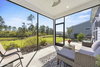 3205 Laughing Gull Terrace, Wilmington, NC 28412 — 2-bedroom home in Riverlights - Del Webb, Wilmington, NC, photo 4 of 60: 36_screened porch