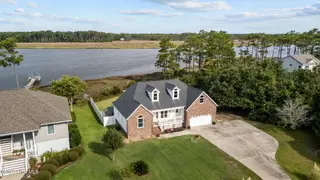 413 Pelican Harbor Road, Beaufort, NC 28516 — 3-bedroom home in Wards Creek Plantation, Beaufort, NC, photo 2 of 30: Aerial Front