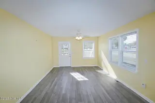 802 E Oak Island Drive, Oak Island, NC 28465 – photo 15: Living Room-010-007-1500x1000