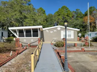 717 Live Oak Drive, Sunset Beach, NC 28468 – photo 2: 20241127_111009