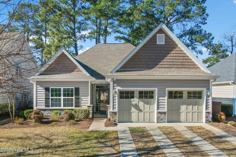 123 Bellwood Circle, Sunset Beach, NC 28468 – photo 1 of 45: Front of home