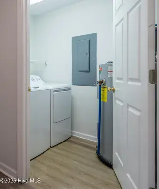 3350 Club Villas Drive 104, Southport, NC 28461 — 2-bedroom condo in St James, Southport, NC, photo 24 of 34: Convenient Laundry Room