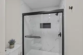 651 Salter Path Road 20b, Pine Knoll Shores, NC 28512 – photo 18: Custom Tile Shower in Primary Bathroom