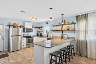 508 W Beach Drive, Oak Island, NC 28465 – photo 20: Bar with stools