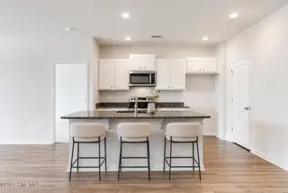 1038 Burled Oak Ridge Loop SE, Bolivia, NC 28422 — 3-bedroom home in Avalon, Bolivia, NC, photo 11 of 64: vitually staged island