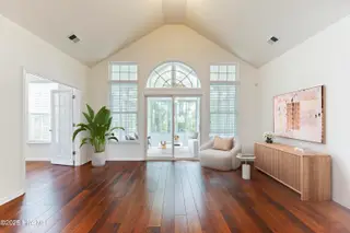907 Corn Planters Circle, Carolina Shores, NC 28467 — 3-bedroom home in The Farm, Carolina Shores, NC, photo 21 of 77: living room and sunroom_final