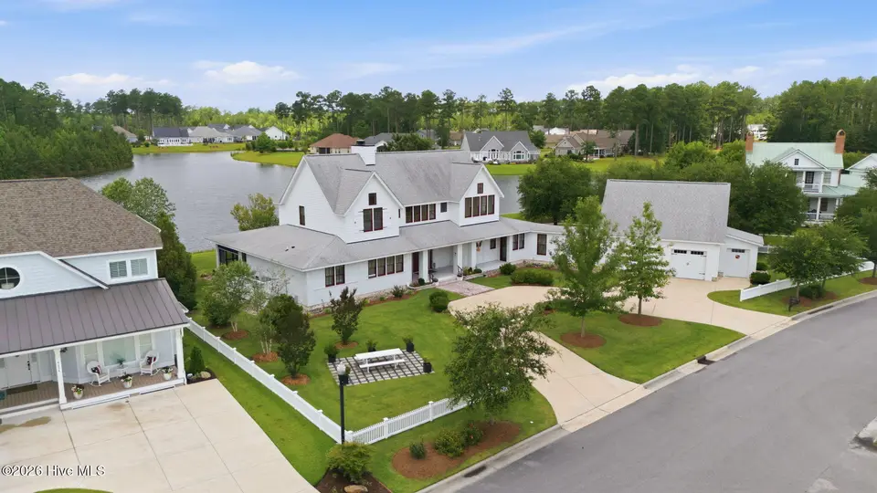4030 Reunion Pointe Lane, New Bern, NC 28562 – photo 1 of 73: 7-web-or-mls-DJI_20260617115734_0706_D