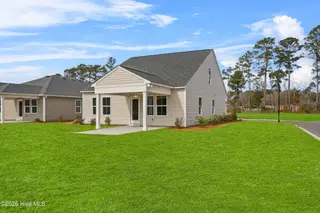 7483 Julius Drive NE 60, Leland, NC 28451 – photo 3: Backyard and porch