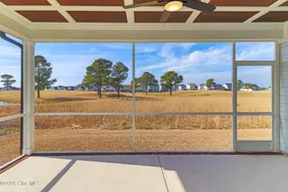 119 Windswept Lane, Beaufort, NC 28516 – photo 4: Screened Porch Overlooking Golf Course