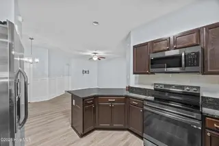 323 Cedar Island Trail, Holly Ridge, NC 28445 — 3-bedroom townhome in The Landing At Folkstone, Holly Ridge, NC, photo 14 of 36: 18_kitchen