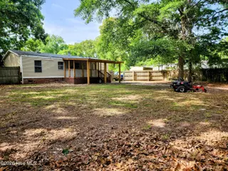 623 Sandy Bluff Drive SW, Supply, NC 28462 — 3-bedroom manufactured home in Sandy Bluff, Supply, NC, photo 20 of 26: Fenced Back Yard