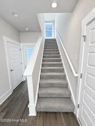 8615 Blue Haw Way Lot 125, Leland, NC 28451 — 3-bedroom home in Indigo Preserve, Leland, NC, photo 21 of 41: Staircase