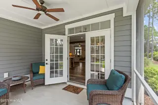 3997 Wyndmere Drive, Southport, NC 28461 – photo 21: Inviting Screened Patio with Ceiling Fan