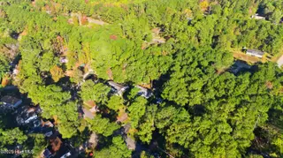 243 Ocean Forest Drive NW, Calabash, NC 28467 — 3-bedroom manufactured home in Ocean Forest, Calabash, NC, photo 20 of 61: DJI_20251101095612_0005_D