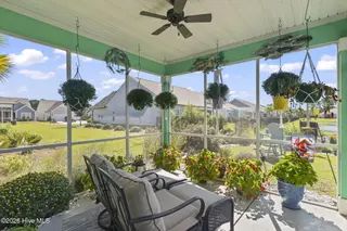 9410 Barnstormer Drive NW, Calabash, NC 28467 — 3-bedroom home in Eagle Run, Calabash, NC, photo 22 of 47: Screened-in Porch
