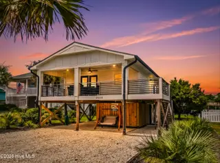 2508 E Beach Drive, Oak Island, NC 28465 – photo 1: DJI_20250809115038_0054_D-Edit_twilight_