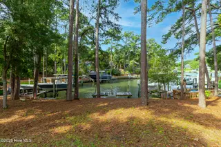 117 White Ash Drive, Pine Knoll Shores, NC 28512 – photo 12: Dock at end of canal