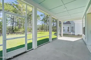 1560 St. Lucia Drive SW, Shallotte, NC 28470 – photo 3: Screened patio