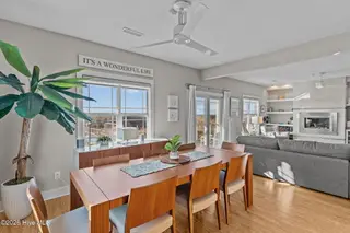 7403 E Beach Drive, Oak Island, NC 28465 – photo 12: Dining Area Flowing into Living Space