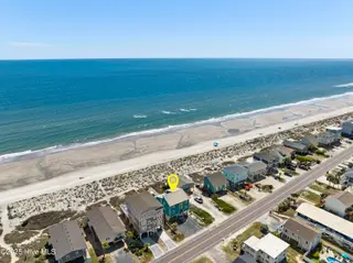 1123 E Beach Drive, Oak Island, NC 28465 – photo 3: mls-DJI_20250428104333_0101_D copy