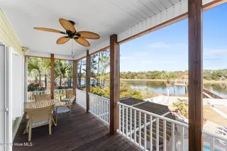 1404 W Yacht Drive, Oak Island, NC 28465 – photo 11: Screened in porch
