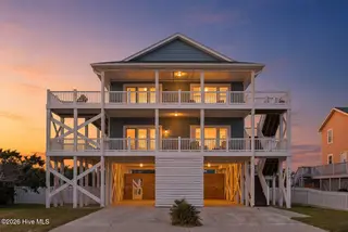 6626 W Beach Drive, Oak Island, NC 28465 – photo 2: 6626WestBeachDriveTwilight-4