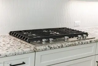 1943 Redfish SW, Supply, NC 28462 — 4-bedroom home in Oyster Harbour, Supply, NC, photo 18 of 42: Gas Cooktop