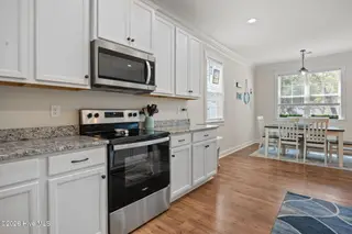 129 NW 11th Street, Oak Island, NC 28465 – photo 13: kitchen-dining