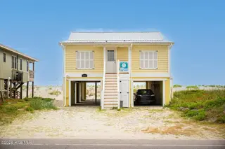 1025 W Beach Drive, Oak Island, NC 28465 – photo 1: 1025 W Beach 55