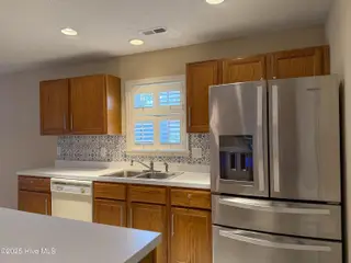 9402 Short Putt Court, Wilmington, NC 28412 — 3-bedroom home in Cypress Island, Wilmington, NC, photo 19 of 47: Stainless Steel Fridge