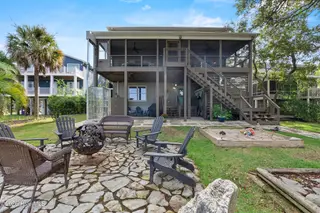 104 SW Yacht Drive, Oak Island, NC 28465 — 5-bedroom waterfront home, Oak Island, NC, photo 5 of 77: 87_back exterior