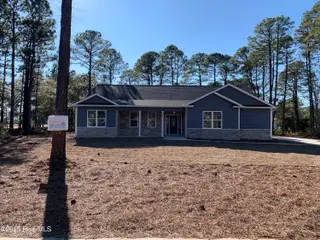 80 Pinewood Drive, Carolina Shores, NC 28467 – photo 1: Front