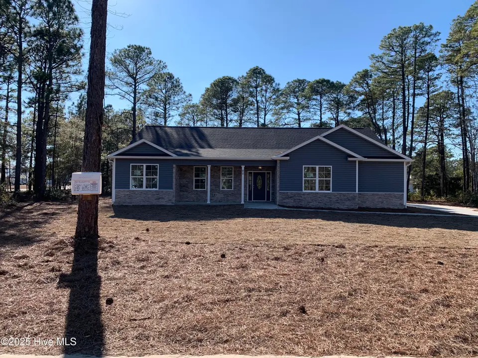 80 Pinewood Drive, Carolina Shores, NC 28467 – photo 1 of 31: Front