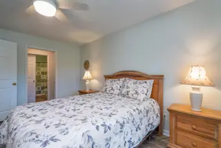 3350 Club Villas Drive 104, Southport, NC 28461 — 2-bedroom condo in St James, Southport, NC, photo 21 of 34: Closet and Full Bath