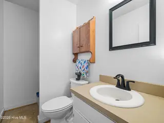139 Bayberry Road, Newport, NC 28570 – photo 23: Half bath off primary bedroom