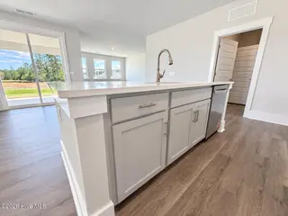 8615 Blue Haw Way Lot 125, Leland, NC 28451 — 3-bedroom home in Indigo Preserve, Leland, NC, photo 7 of 41: Kitchen Island
