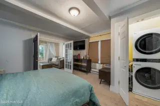 411 Spartanburg Avenue, Carolina Beach, NC 28428 – photo 15: Primary Suite w/ Laundry Closet