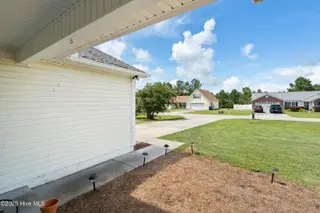 2947 Bay Village Street, Shallotte, NC 28470 — 3-bedroom home in Green Bay Village, Shallotte, NC, photo 6 of 33: View from the covered porch