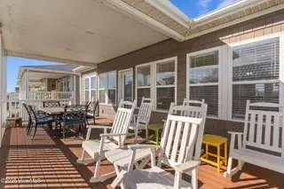 390 E Second Street, Ocean Isle Beach, NC 28469 – photo 11: Rocking chairs on deck