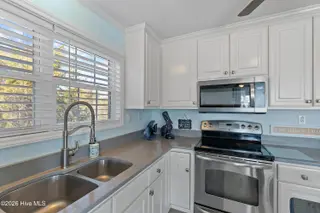 316 E Dolphin Drive, Oak Island, NC 28465 – photo 8: 316EDolphinDr - 26