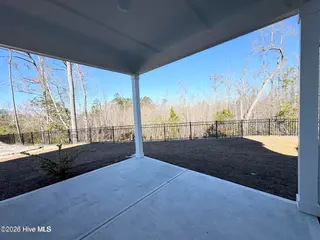 2012 Red Woodpeckers Court, Leland, NC 28451 — 3-bedroom home in Terrapin, Leland, NC, photo 16 of 23: Backyard view