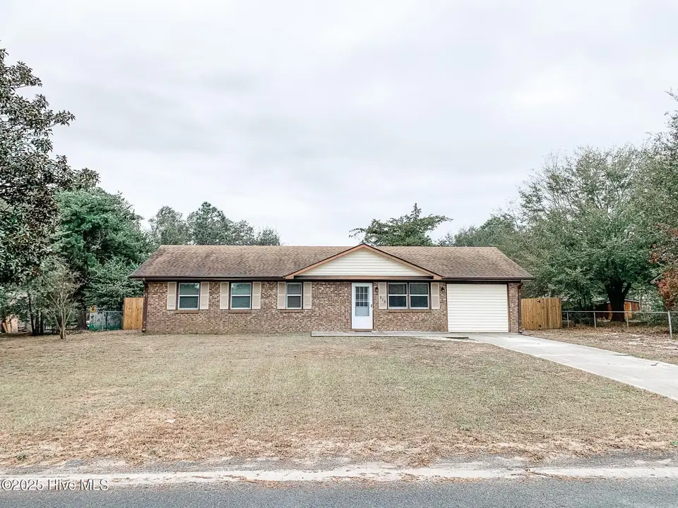 213 Santa Ana Drive, Wilmington, NC 28412 — 3-bedroom home in Monterey Heights, Wilmington, NC, photo 1 of 13: front