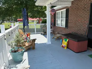 144 Waccamaw Shores Road, Lake Waccamaw, NC 28450 – photo 17: Spacious Front Porch