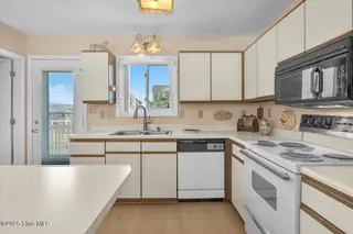 1708 W Beach Drive, Oak Island, NC 28465 – photo 12: 11-Final 1708 W Beach Dr OKI-RJREM-1832