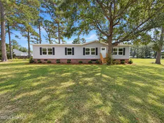809 Garner Drive, Newport, NC 28570 – photo 1: Ai enhanced front of 809 Garner